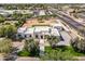 Wide overhead view of the property showcasing modern architecture, desert landscaping, and a private drive at 9611 E Clinton St, Scottsdale, AZ 85260