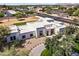 Aerial view of home with modern architecture, desert landscaping, and a circular driveway at 9611 E Clinton St, Scottsdale, AZ 85260