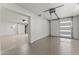 Spacious garage features epoxy flooring and a modern garage door opener at 9611 E Clinton St, Scottsdale, AZ 85260
