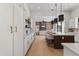 Spacious kitchen with island seating, stainless steel appliances, and wood floors at 9611 E Clinton St, Scottsdale, AZ 85260