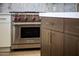 Close up on a stainless steel Wolf oven adjacent to the island at 9611 E Clinton St, Scottsdale, AZ 85260