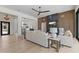 Open concept living area with a modern fireplace, wood floors, and high ceilings at 9611 E Clinton St, Scottsdale, AZ 85260