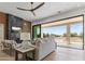 Comfortable living space featuring a modern fireplace and outdoor access at 9611 E Clinton St, Scottsdale, AZ 85260
