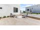 Stylish outdoor seating area features a modern firepit and comfortable chairs, creating a cozy and inviting space at 9611 E Clinton St, Scottsdale, AZ 85260
