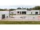 Modern home with backyard pool, fresh grass and landscaped yard at 9611 E Clinton St, Scottsdale, AZ 85260
