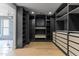 Walk-in closet leading to a bathroom with a bathtub and a glass shower at 9611 E Clinton St, Scottsdale, AZ 85260