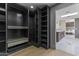 Spacious walk-in closet with custom shelving and storage system at 9611 E Clinton St, Scottsdale, AZ 85260