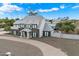 Stunning two-story home featuring a circular driveway and beautiful stone accents at 9821 E Larkspur Dr, Scottsdale, AZ 85260