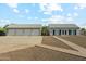 Spacious six-car garage with additional room for parking and storage at 9821 E Larkspur Dr, Scottsdale, AZ 85260