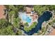 Aerial view of the community pool and pond area surrounded by lush landscaping at 10015 E Mountain View Rd # 2034, Scottsdale, AZ 85258