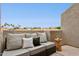Private balcony with comfortable seating and views of the neighborhood at 10015 E Mountain View Rd # 2034, Scottsdale, AZ 85258