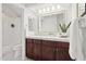 Bathroom with marble countertop, wood cabinets, and tiled shower and bathtub at 10015 E Mountain View Rd # 2034, Scottsdale, AZ 85258