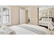 Bright bedroom featuring large windows, neutral decor, and mirrored closet doors at 10015 E Mountain View Rd # 2034, Scottsdale, AZ 85258