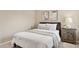 Cozy bedroom with neutral decor, a comfortable bed, and a wooden nightstand at 10015 E Mountain View Rd # 2034, Scottsdale, AZ 85258