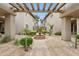 Exterior courtyard with a decorative fountain and lush landscaping at 10015 E Mountain View Rd # 2034, Scottsdale, AZ 85258