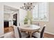 Bright dining area with a chandelier, shuttered windows and convenient access to the kitchen at 10015 E Mountain View Rd # 2034, Scottsdale, AZ 85258