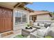 Inviting front porch with outdoor seating area and a decorative welcome mat near the front door at 10015 E Mountain View Rd # 2034, Scottsdale, AZ 85258