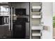Modern kitchen features stainless steel appliances, and ample storage with pull-out shelving at 10015 E Mountain View Rd # 2034, Scottsdale, AZ 85258