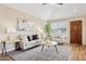 Comfortable living room with cozy seating, neutral decor, and an abundance of natural light through shuttered windows at 10015 E Mountain View Rd # 2034, Scottsdale, AZ 85258