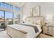 Bright main bedroom with a chandelier, large windows, and a private balcony at 10015 E Mountain View Rd # 2034, Scottsdale, AZ 85258