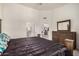 Comfortable bedroom with ensuite bathroom and a view into the open-concept kitchen and dining area at 10136 E Southern Ave # 3091, Mesa, AZ 85209
