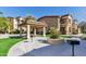 Exterior view of a lush green community courtyard with covered seating areas for residents at 10136 E Southern Ave # 3091, Mesa, AZ 85209