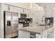 Well-appointed kitchen with stainless steel appliances, granite countertops, and white cabinetry at 10136 E Southern Ave # 3091, Mesa, AZ 85209