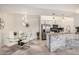 Stylish dining area and kitchen with stainless steel appliances, granite countertops, and white cabinetry at 10136 E Southern Ave # 3091, Mesa, AZ 85209