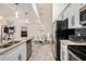 Modern kitchen with stainless appliances, a breakfast bar overlooking the dining area with glass top table at 10136 E Southern Ave # 3091, Mesa, AZ 85209