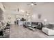 Open-concept living room with dining area and kitchen, featuring modern furniture and fixtures at 10136 E Southern Ave # 3091, Mesa, AZ 85209
