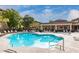 Inviting community pool with ample lounge chairs and a covered seating area, perfect for summer relaxation at 10136 E Southern Ave # 3091, Mesa, AZ 85209