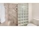 Luxurious tiled shower featuring a glass block partition at 10136 E Southern Ave # 3091, Mesa, AZ 85209