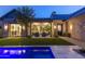 Backyard with a pool and patio featuring outdoor furniture and desert landscaping at 10179 E Camelot Ct, Scottsdale, AZ 85255