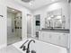 Bathroom featuring a glass enclosed shower with matte black shower head and hardware at 10179 E Camelot Ct, Scottsdale, AZ 85255