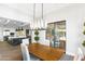 Bright dining area adjacent to the kitchen, featuring a modern chandelier and natural light at 10179 E Camelot Ct, Scottsdale, AZ 85255