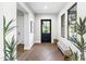 Bright entryway featuring herringbone wood floors, natural light, and a stylish bench at 10179 E Camelot Ct, Scottsdale, AZ 85255