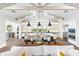 Open-concept kitchen with island seating, pendant lights, and modern appliances at 10179 E Camelot Ct, Scottsdale, AZ 85255