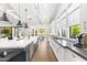 Modern kitchen with stainless steel appliances, long countertops, and an island for additional prep space at 10179 E Camelot Ct, Scottsdale, AZ 85255