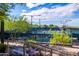 Active pickleball courts on a sunny day surrounded by lush landscaping and community amenities at 10179 E Camelot Ct, Scottsdale, AZ 85255
