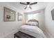 Cozy bedroom with a ceiling fan, plush carpet, and a comfortable queen-sized bed at 10849 S 175Th Dr, Goodyear, AZ 85338