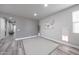 Versatile flex room featuring neutral walls, wood-look flooring, and natural light from a window at 10849 S 175Th Dr, Goodyear, AZ 85338