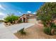 Charming home featuring stone accents, a well-maintained yard, and a two-car garage at 10849 S 175Th Dr, Goodyear, AZ 85338