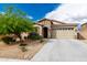 Charming home featuring stone accents, a well-maintained yard, and a two-car garage at 10849 S 175Th Dr, Goodyear, AZ 85338