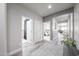 Inviting hallway with hardwood floors and neutral colors, leading to various rooms at 10849 S 175Th Dr, Goodyear, AZ 85338