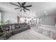 Open living space with a kitchen island, breakfast bar seating, and a comfortable living room area at 10849 S 175Th Dr, Goodyear, AZ 85338