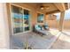 Inviting covered patio with comfortable seating, perfect for outdoor relaxation and entertaining at 10849 S 175Th Dr, Goodyear, AZ 85338