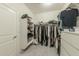 Large walk-in closet features custom shelving, drawers, and ample storage space at 10849 S 175Th Dr, Goodyear, AZ 85338