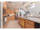 Bright kitchen featuring stainless steel appliances, granite countertops, and light wood cabinets at 11003 E Ravenna Cir, Mesa, AZ 85212