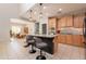 Modern kitchen featuring a kitchen island with granite countertops and pendant lighting at 11003 E Ravenna Cir, Mesa, AZ 85212