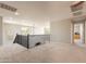 This loft features neutral carpeting, neutral walls, and lots of natural light at 11003 E Ravenna Cir, Mesa, AZ 85212